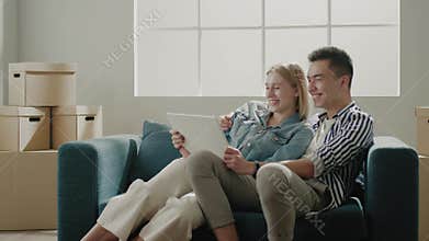 Family holds tablet with modern dream apartment design