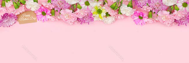 Happy Mothers Day gift tag with long top border of flowers on a pink banner background