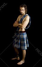 Young man dressed in a scottish kilt