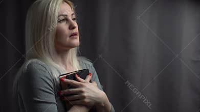 Woman reading the Holy Bible, Reading a book