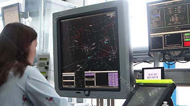 10-02-2021 KAZAN, RUSSIA, Kazan International Airport: woman worker sits in the airport control room and doing her job