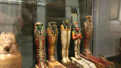 Egyptian Museum, Turin, Italy - February 2021: exhibition of traditional figurines and canopic vases