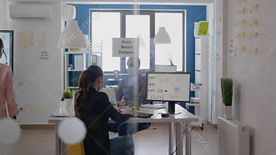 Two coworkers touching elbow during coronavirus global pandemic