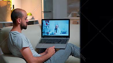 Sick man having online telemedicine consultation during covid-19