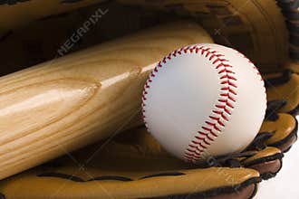 Baseball and baseball bat in glove
