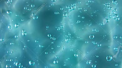 Blue serum texture, clear liquid gel background. Motion of the transparent beauty skincare product sample with bubbles