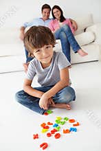 Parents watching son play