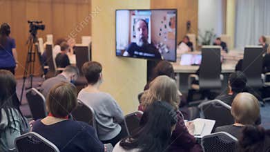 Audience listens to the lecturer