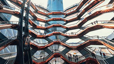 Time-lapse of people traveling at the Vessel architectural walking stairs in Hudson Yards Public Square, NYC USA