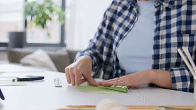 woman making paper craft at home