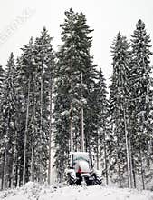 Tractor in winter forest