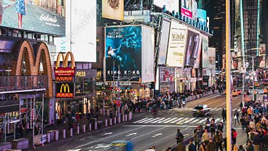 Time-lapse of crowd of people, car traffic transportation and advertisement at night in Times Square