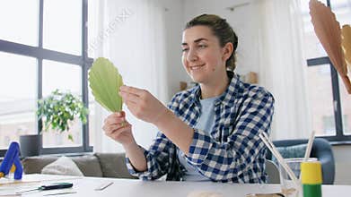 woman making paper craft at home