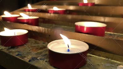 Row of candle lights in a church
