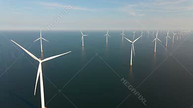 Wind turbine from aerial view, Drone view at windfarm Westermeerdijk a windmill farm in the lake IJsselmeer the biggest