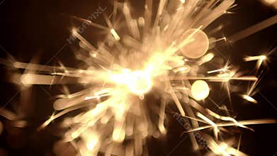 Overhead view of a burning sparkler firework with hot glowing embers. For 4th of July or New years celebration