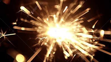 Overhead view of a burning sparkler firework with hot glowing embers. For 4th of July or New years celebration