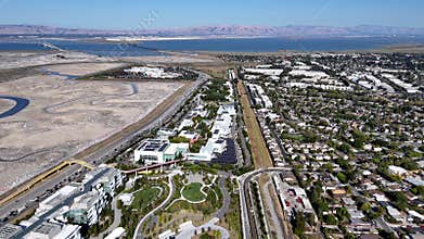 Meta headquarters aerial view with bay, wetlands, and residential areas