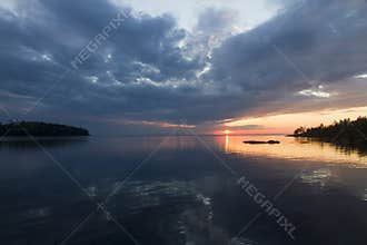 Thunder clouds during sunset over Lake Ladoga