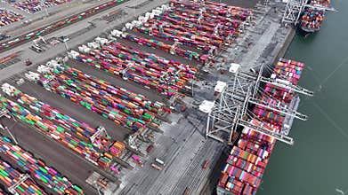 Drone shot of modern industrial port of Rotterdam with containers.