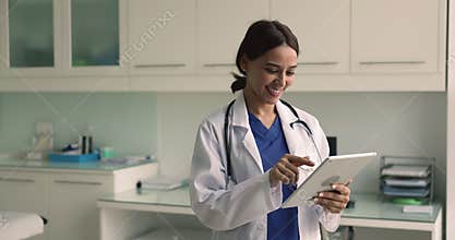 Workflow of woman cardiologist using digital tablet device