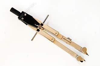 Metal compass on a white background in perspective