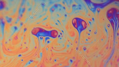 Gasoline rainbow paint mix color droplets flow
