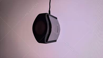 A professional colorimeter measures color patches on a monitor, ensuring accurate calibration for critical color work