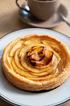 French fresh baked sweet puff pastry with fresh apple fruits in sirup in confectionery shop