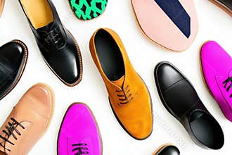 Colorful diversity of men's shoes in various styles on white background