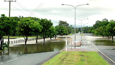 Flood water flowing across a dual carriageway road after a heavy thunderstorm