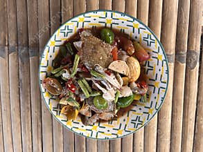 Fried Papaya salad with shrimp seafood , Thai food style.