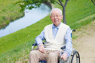 Asian senior man sitting on a wheelchair