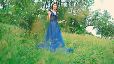 Sexy woman body part beauty face blue dress lace elegant royal luxury long ball gown. spring nature green tree field