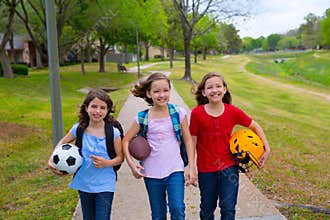 Children kid girls walking to schoool with sport balls