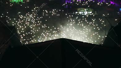 2021-08-08 - Mariupol City Festival, Ukraine. Aerial view of music festival stage at night. Lights beam from stage as