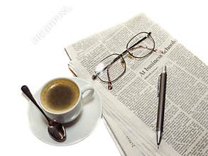 Coffee, the newspaper, pencil