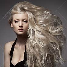 Beautiful Blond Woman. Curly Long Hair