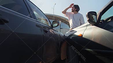 Driver is disappointed by the cost of repairing his expensive vehicle and becomes angry with the other driver.