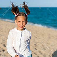 Happy girl with ponytails.