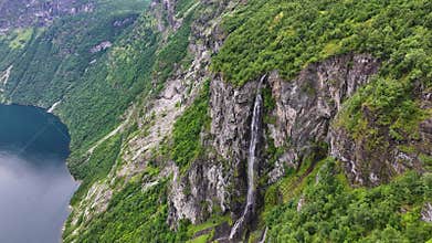 Aerial View of Seven Sisters Waterfall Above Fjord in Landscape of Norway