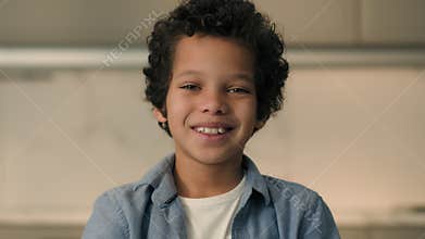 Portrait little African American boy child son schoolboy happy joyful smiling male pupil school kid junior orphan