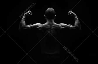 Strong fitness man flexing