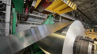 Aluminum sheet uncoils from roll on special