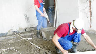 Three workers constructing a new floor in an