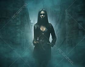 Fashion shoot of a young and brunette in fog