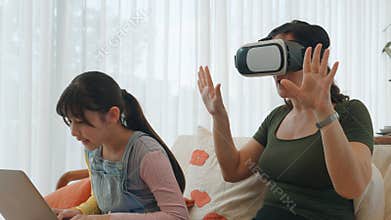 Granddaughter guide grandmother to dive in metaverse with VR. Divergence.