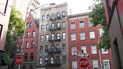 New York City building architecture. Urban residential house exterior. Real estate. Red brick facade