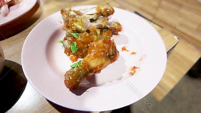 Chicken leg bones with sauce.