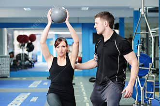 Using medicine ball with personal trainer